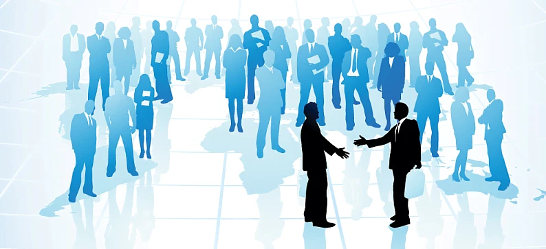 A diverse crowd of people collaborating on a science project. The image conveys the concept of management and teamwork in a busy and productive environment.